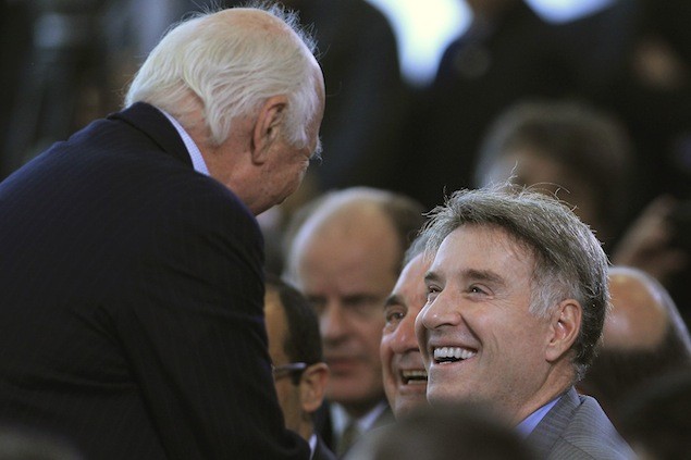 Entrepreneurs Jorge Gerdau Johannpeter, left, and Eike Batista speak to each other during a ceremony for the announcement of a port investment program at the Planalto Palace in Brasilia December 6, 2012. Brazil's government launched a $26 billion (54.2 billion reais) port investment program on Thursday to reduce the high costs and notorious delays in shipping goods in and out of the major commodities exporter. REUTERS/Ueslei Marcelino