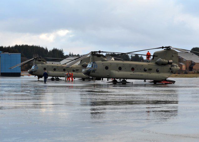 Two CH-47 Chinook helicopters from the Army 16th Combat Aviation Brigade, out of Ft. Wainwright, Alaska, land at Air Station Kodiak, Friday, Jan. 4, 2012. Members of the 16th Combat Aviation Brigade are in Kodiak to assist with the lift and transportation of heavy equipment that will be moved to the Kulluk to assist with the salvage of the conical drilling unit. U.S. Coast Guard photo by Petty Officer 3rd Class Jonathan Klingenberg.