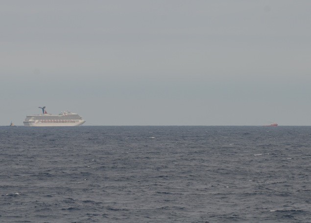 GULF OF MEXICO - The Carnival Cruise Ship Triumph is towed by the tug vessels Pioneer and Roland Falgout toward Mobile, Ala., Feb. 13, 2013. U.S. Coast Guard photo