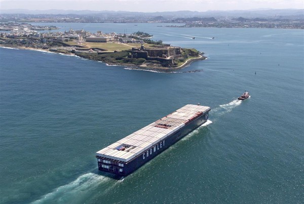 Carriers currently use 17 vessels to provide their shipping services, including 5 self-propelled containerships and 12 container barges that are pulled by tugboats, with an average 30 years for a containership and about 27 years. Photo courtesy Crowley