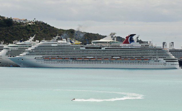 A view of the Carnival Dream cruise ship moored at the A.C. Wathey Cruise Facilities after a diesel generator malfunctioned causing temporary disruptions, in Philipsburg, Sint Maarten, March 14, 2013. A Carnival Cruise Lines ship was stuck at a Caribbean port with equipment trouble on Thursday, a month after another Carnival vessel was disabled by a fire that trapped thousands of passengers at sea for days. Carnival Corp said it was making arrangements to fly the passengers, via charter flights and regularly scheduled flights from the Caribbean island, to Orlando or their final destination. REUTERS/John Halley (SINT MAARTEN - Tags: DISASTER TRAVEL)