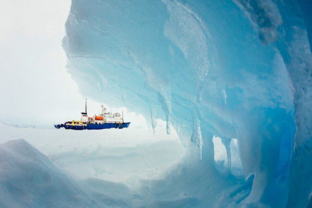 The MV Akademik Shokalskiy is pictured stranded in ice in Antarctica, December 29, 2013. An Antarctic blizzard has halted an Australian icebreaker's bid to reach a Russian ship trapped for a week with 74 people onboard, rescuers said on Monday. REUTERS/Andrew Peacock